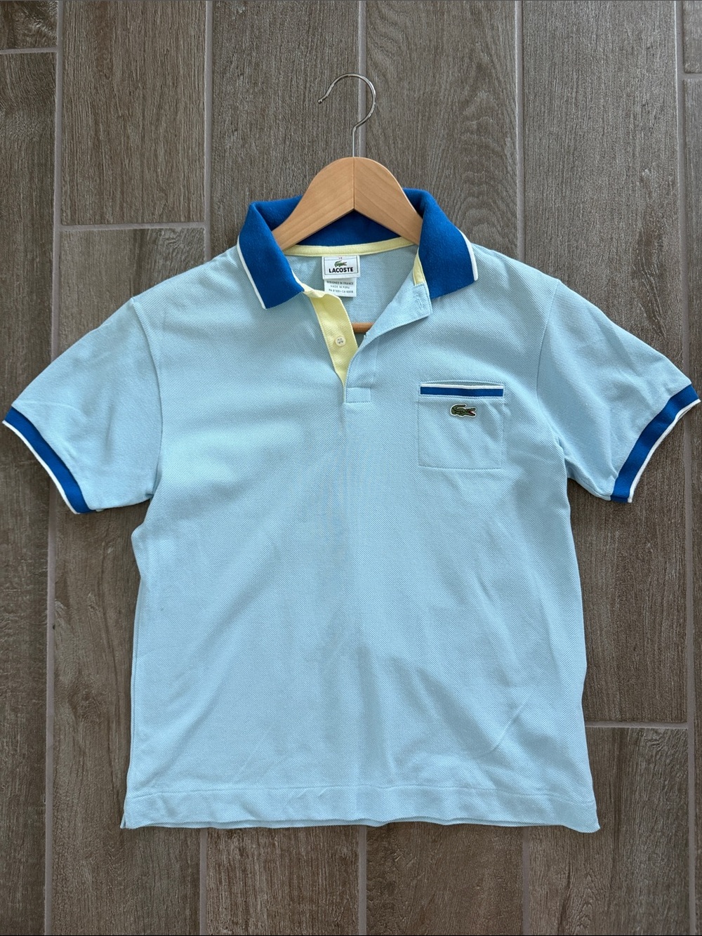 In excellent condition Authentic Boys light Blue Lacoste Polo size 14